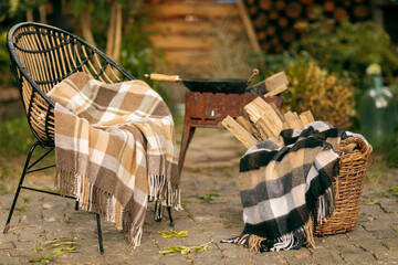 the concept of warm and cozy plaids in nature in the park for outdoor activities or a picnic 
