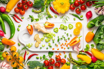Fresh assorted vegetables and herbs on white background. Healthy clean eating, vegetarian or diet food concept.Food frame.