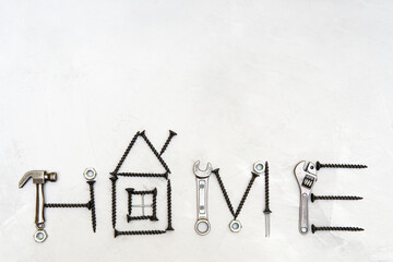 Word HOME shaped from hand tools and fasteners