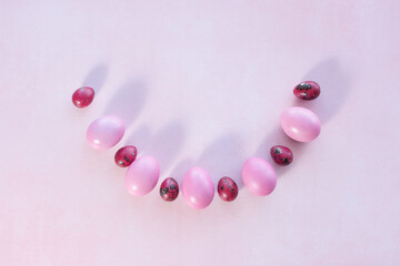 pink easter eggs on pink background with place for text. Minimal