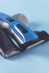 Modern Battery Electric Shaver for Man on Blue Background with Clipping Path Close Up Vertical