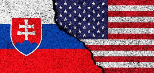 USA and Slovakia. Flags painted on cracked concrete wall. United States, America. Partnership, relationships and conflict concept. Banner background photo