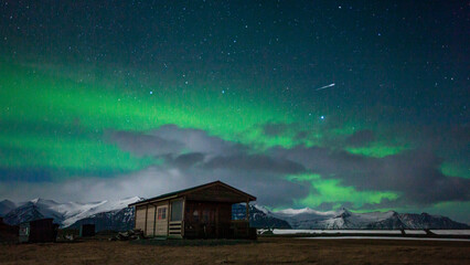 Northern Lights over hut near Jokulsarlon, Iceland