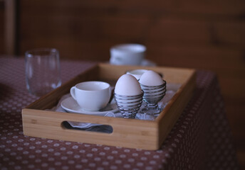 Boiled eggs in a stand, breakfast