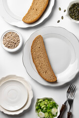 Healthy eating, dieting.  Whole wheat bread and greenery, ready to eat