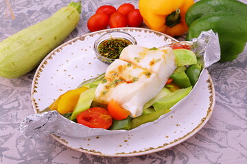 fish baked with vegetables steamed in foil gourmet menu 