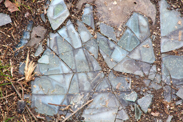 background with small pieces of broken glass covering the ground