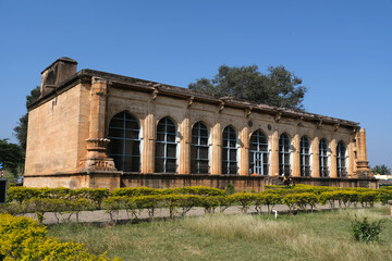 Fototapeta premium 18 December 2021, Santhebennur, Karnataka, India, Musafirkhana and Honda, The large pond (Honda) has its sides veneered with granite steps. Beautiful columns and arches grace the building's interior.