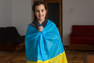 Pray for Ukraine. Child with Ukrainian flag. little girl with ukraine flag