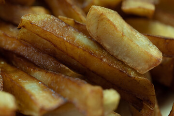 Fried potatoes. Hot fried sliced potatoes. French fries.