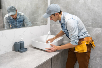 plumber man repair leaky faucet tap