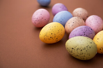 Colored easter eggs on a brown background