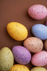 Colored easter eggs on a brown background