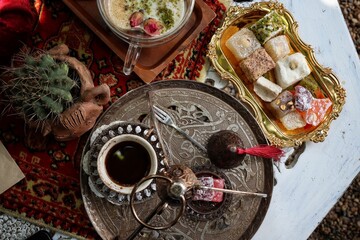 Indian desserts and hot black coffee