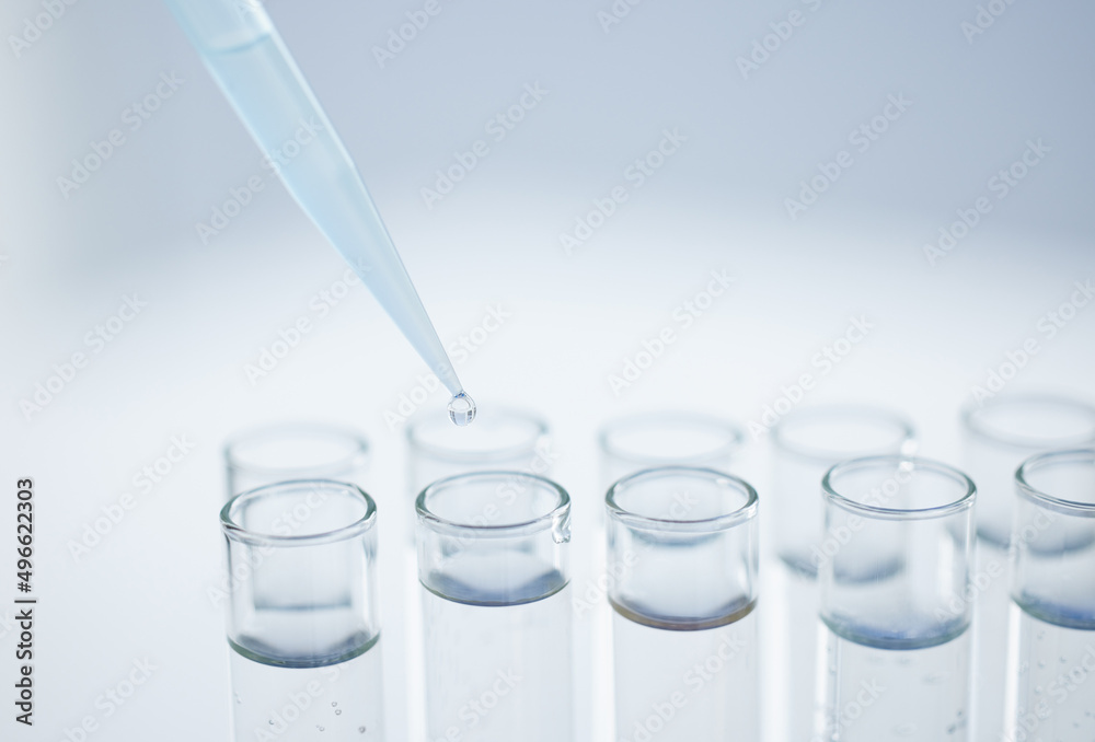 Aufkleber Practising precision in the lab. Closeup shot of a dropper being used to fill test tubes in a lab.