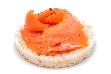 Tasty Rice Cake Sandwich with Fresh Salmon Slices Isolated on White. Easy Breakfast and Diet Food....