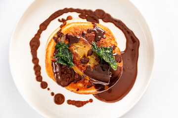 pancakes with chocolate sauce closeup