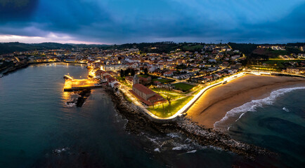 Aerial view of the town of Luanco at dusk, Asturias, Spain.