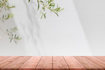Empty wood table top and blurred white wall in garden background with Green leaves - can used for display or montage your products. - 496624386