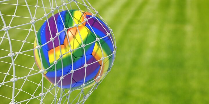 Rainbow color soccer ball in goal net, close up view. LGBT Gay football sport event. 3d render LGBT football sport event. 3d render