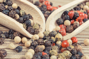 Colored pepper on wooden board. Spice using for cooking