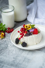 fresh ricotta with berries and flowers