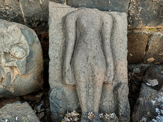 Khidrapur,India- November 6th 2021; Stock photo of Intricate ruined ancient sculpture of India god or goddess, carved out of gray stone in ancient hindu temple,Kopeshwar Mahadev Mandir.