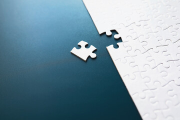 IQ development. Intellectual puzzles. The puzzle is empty. Brain training hand puts puzzle pieces...