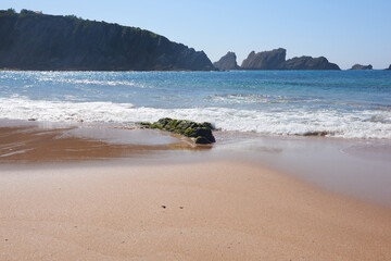 A quiet beach with a turquoise blue sea