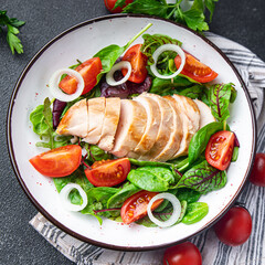 chicken breast salad Easter salad vegetable tomato, onion, green mix leaves lettuce keto or paleo diet fresh meal food snack on the table copy space food background 