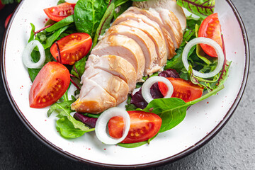 chicken breast salad Easter salad vegetable tomato, onion, green mix leaves lettuce keto or paleo diet fresh meal food snack on the table copy space food background 