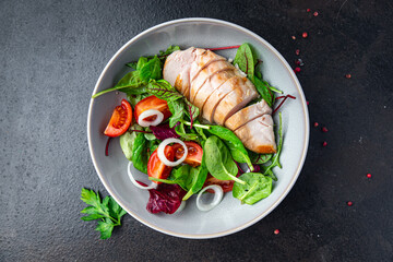 chicken breast salad Easter salad vegetable tomato, onion, green mix leaves lettuce keto or paleo diet fresh meal food snack on the table copy space food background 