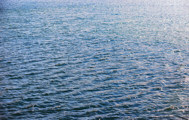 Water surface. The texture of the water. Waves on the lake in windy weather.