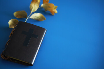 Book with the symbol of the cross. Bible study. Religious book. Prayer.