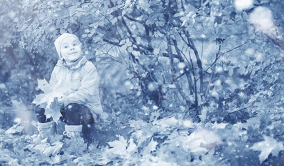 Kids walk in the park first snow