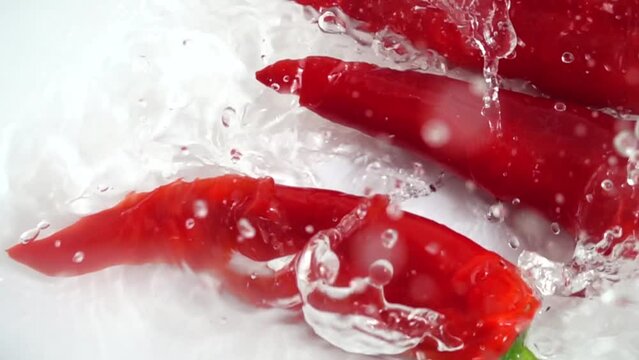 Juicy red Capi pepper. Slow motion.