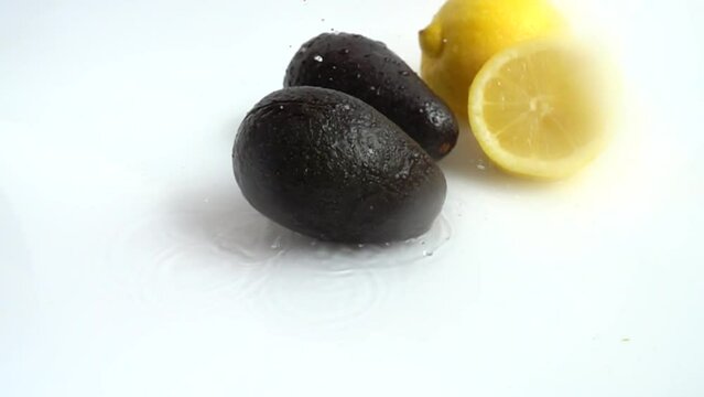 Fresh avocado and juicy lemon. Slow motion.