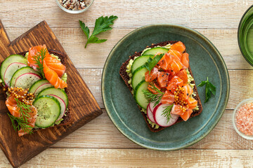 toasts with rye bread, salmon, avocado