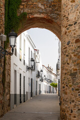 city gate leads into the narrow streets of historic old town Olivenza