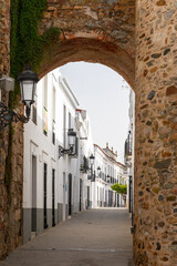 Fototapeta premium city gate leads into the narrow streets of historic old town Olivenza