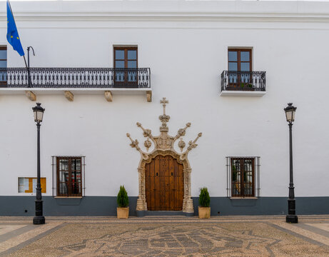 the historic town hall in Olivenza with its ornate stonework arch and door