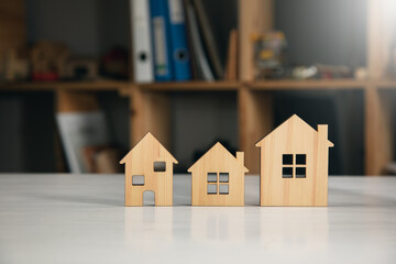 wooden house models on table