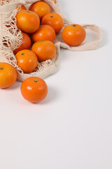 Oranges, healthy fruits, mandarin oranges, vitamin C, oranges in a knitted bag, bought from the market