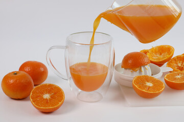 oranges, juice poured from the glass, healthy fruit, mandarin oranges, orange juice, vitamin C, orange peel spiral