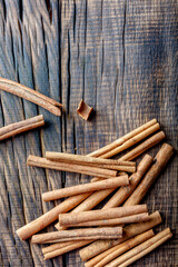 cinnamon on dark wood close up, concept for spices 