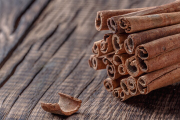 cinnamon on dark wood close up, concept for spices 