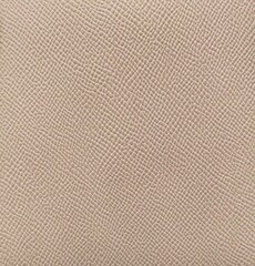 Soft beige leather texture with print as background, surface beige leather background.