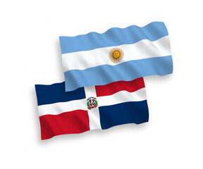 National vector fabric wave flags of Dominican Republic and Argentina isolated on white background. 1 to 2 proportion.
