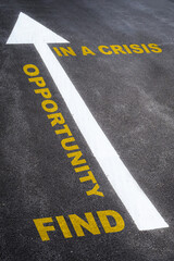 Find opportunity in a crisis written on the road. Business planning concept and new year beginning success idea