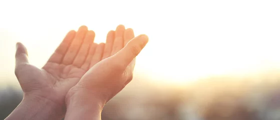 Foto op Plexiglas Human hands open palm up worship Praying with faith and belief in God of an appeal to the sky. Concept Religion and spirituality with believe Power of hope or love and devotion. filler tone vintage. © methaphum